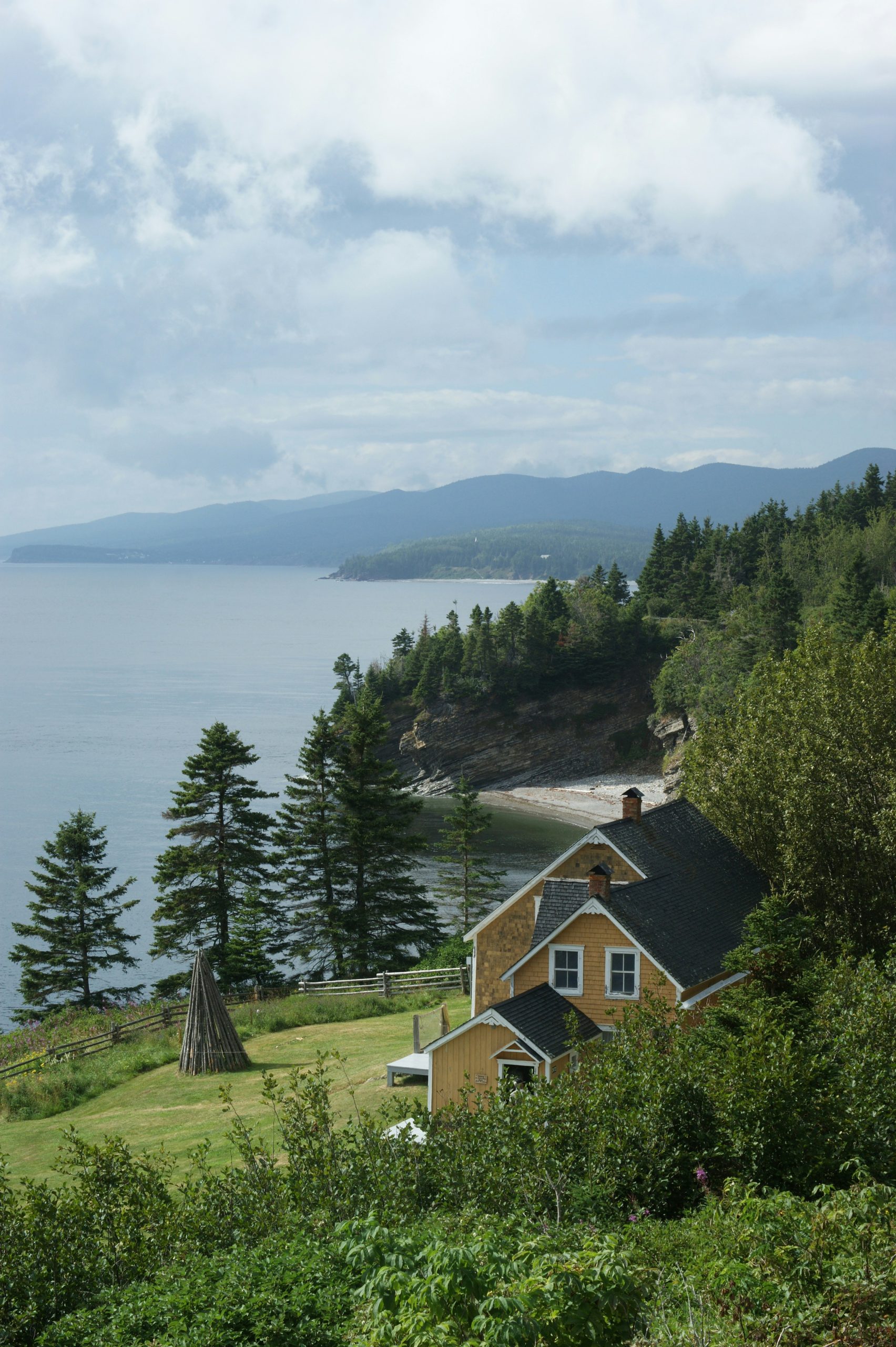 Waterfront cottage property along a forested Kawartha-area shoreline